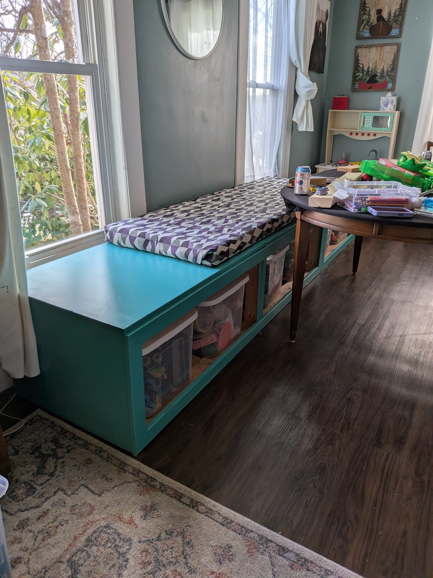 Teal storage bench with open cubbies